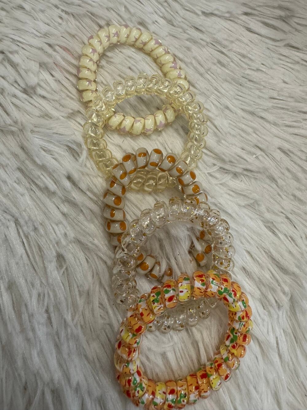 Multi-colored Coil spiral hair ties orange, yellow, and green speckles set of 5